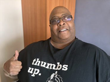 Andrew Wright gives a thumbs up after therapy.