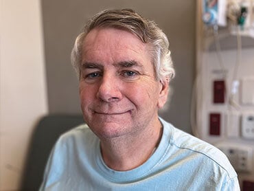 Bill Gierhart smiling after rehabilitation.