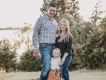 Dallas Fyffe stands with his wife and daughter.