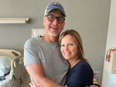Kevin Bush and his wife hug after therapy.